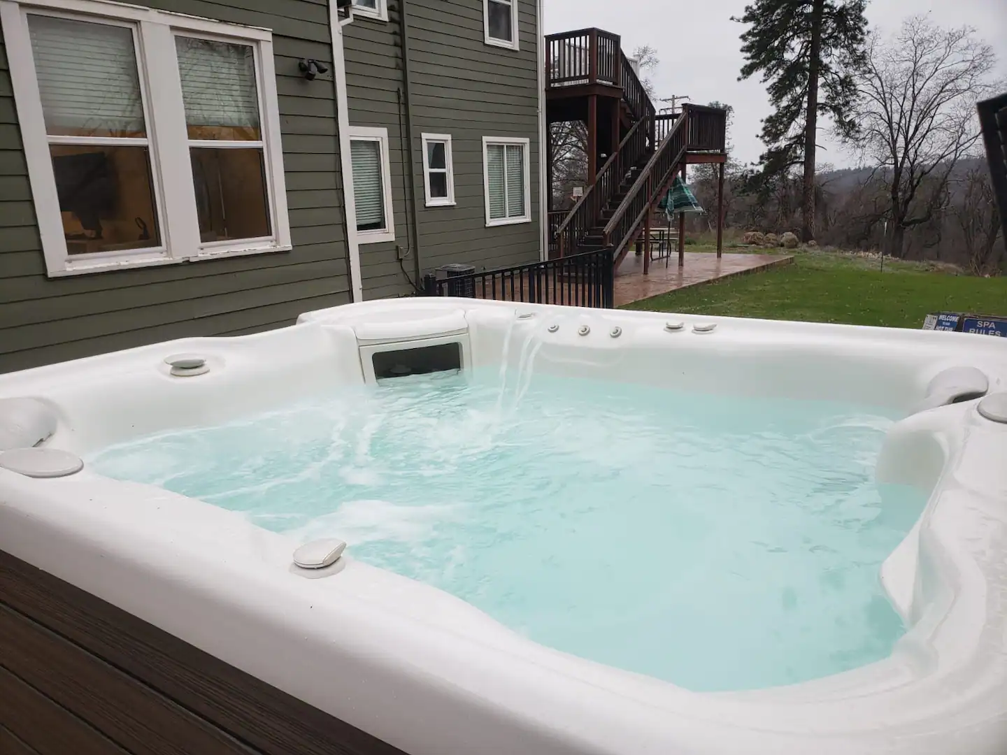 Luxury outdoor hot tub with adjustable massage jets and mood lighting, offering a serene and relaxing experience